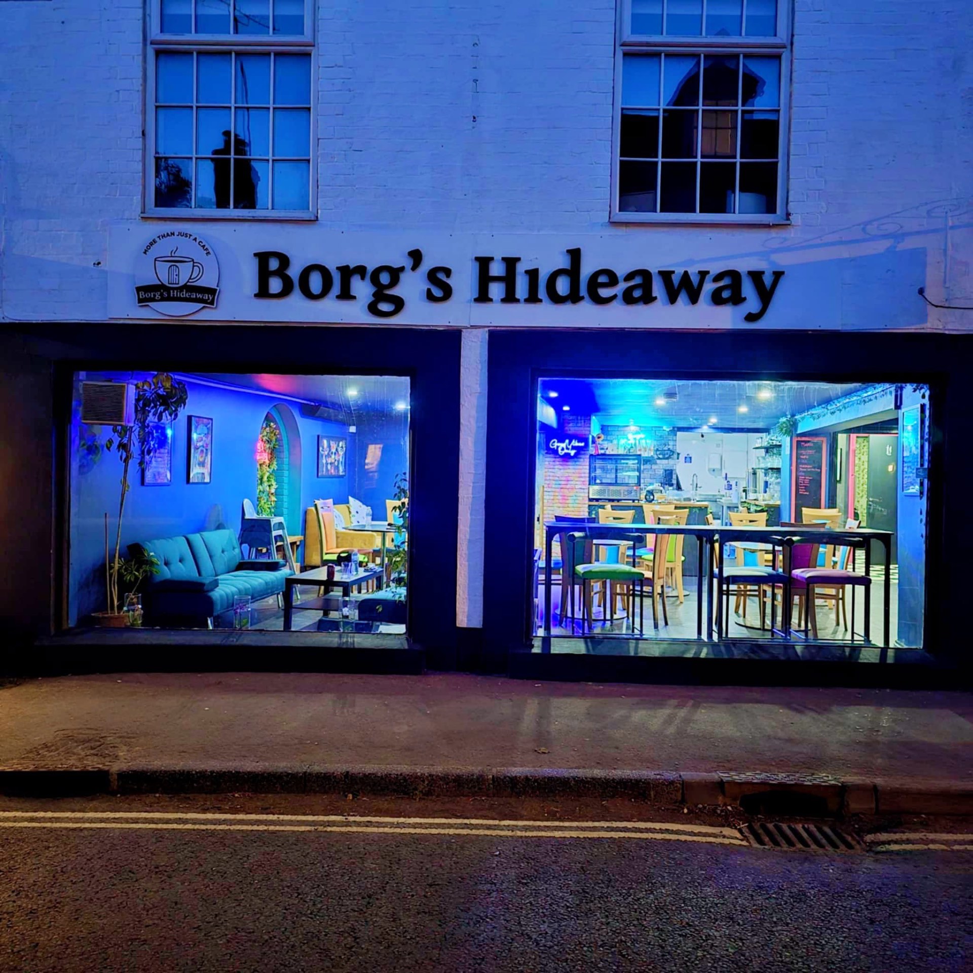 Borg's Hideaway shopfront on Pewsey High Street at dusk